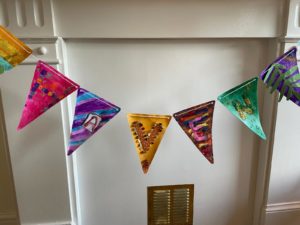 Home made bunting hung on mantlepiece