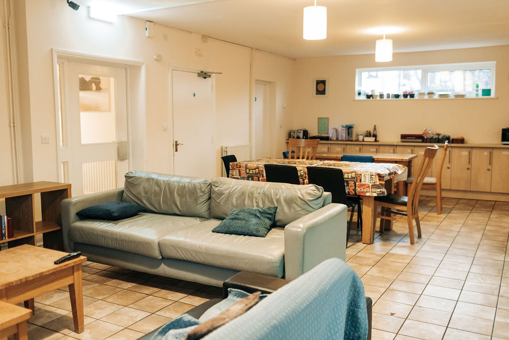 Looking from one of the sofas towards the large dining tables in the communal area at Crossways