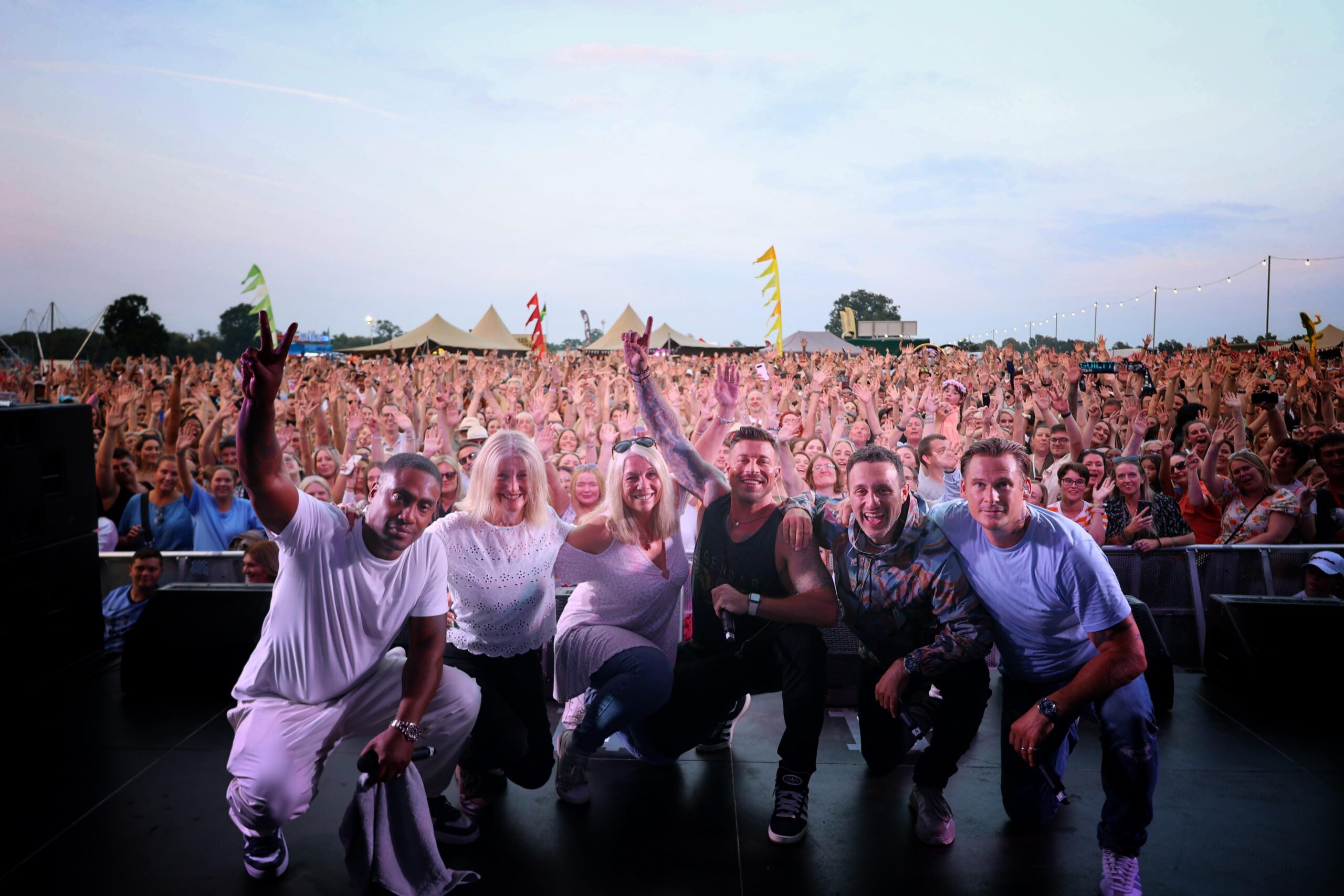 Emma Rule on stage with Blue at Foodies Festival