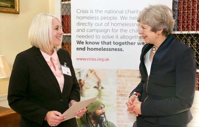 Emma Rule receiving Points Of Light Award from Theresa May in 2016