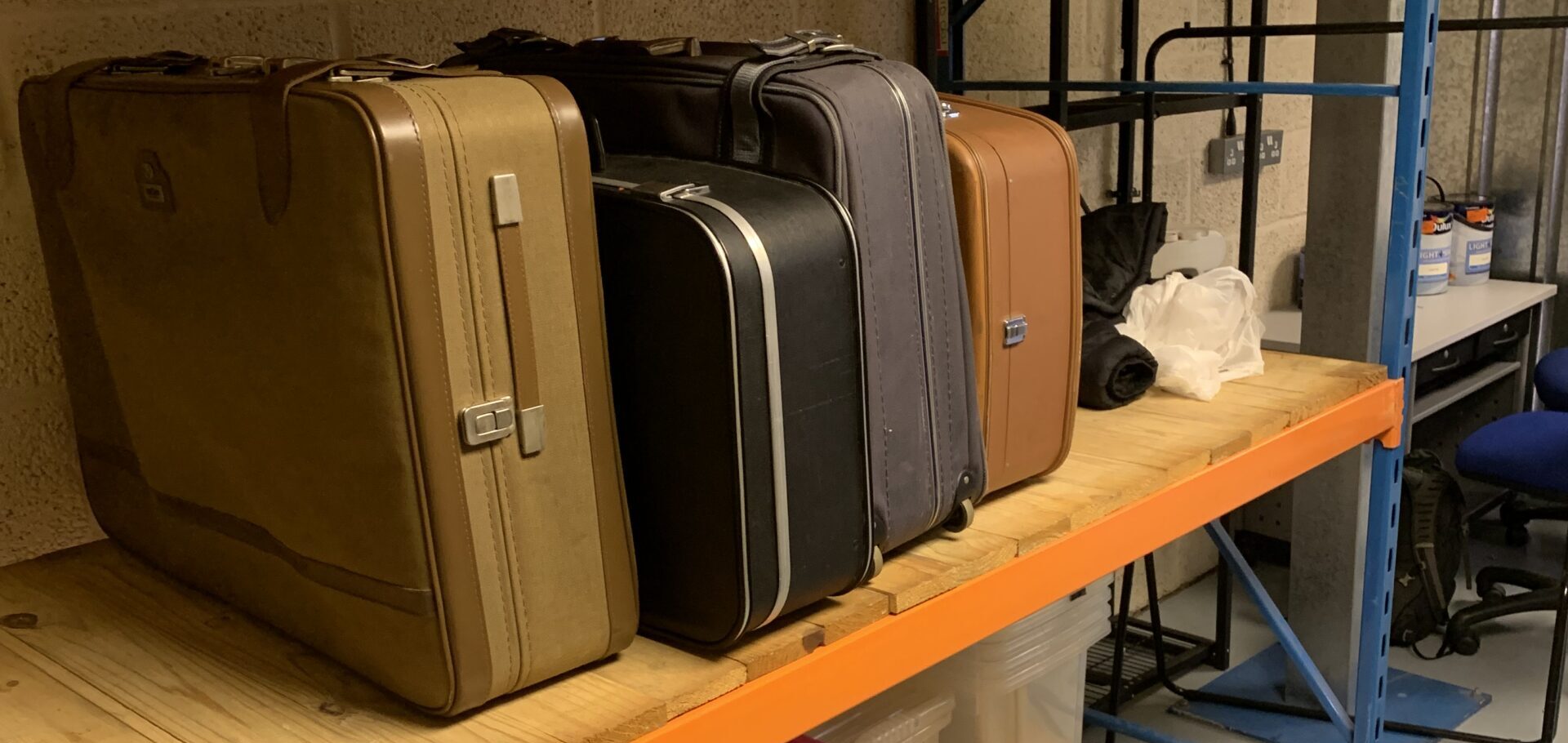 IMG_3132 Four assorted suitcases on heavy duty racking at the Street Storage unit