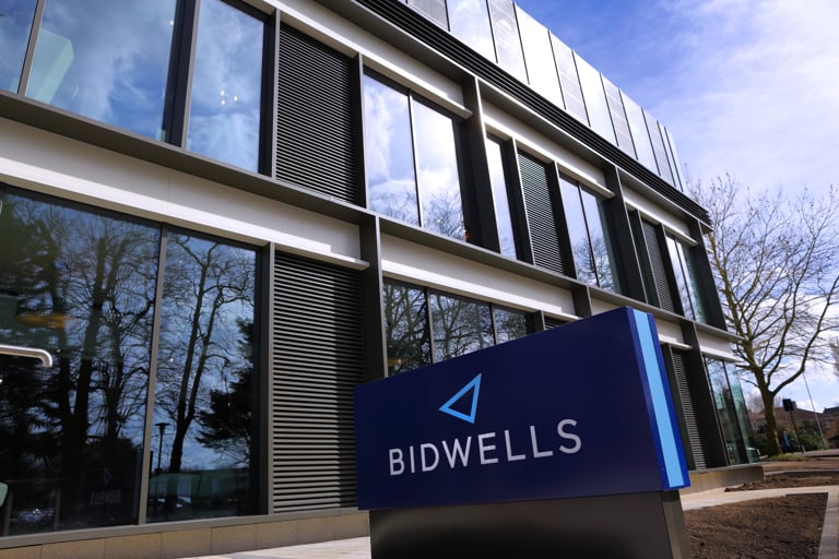 A photo showing a section of Bidwells House with the company logo in the foreground