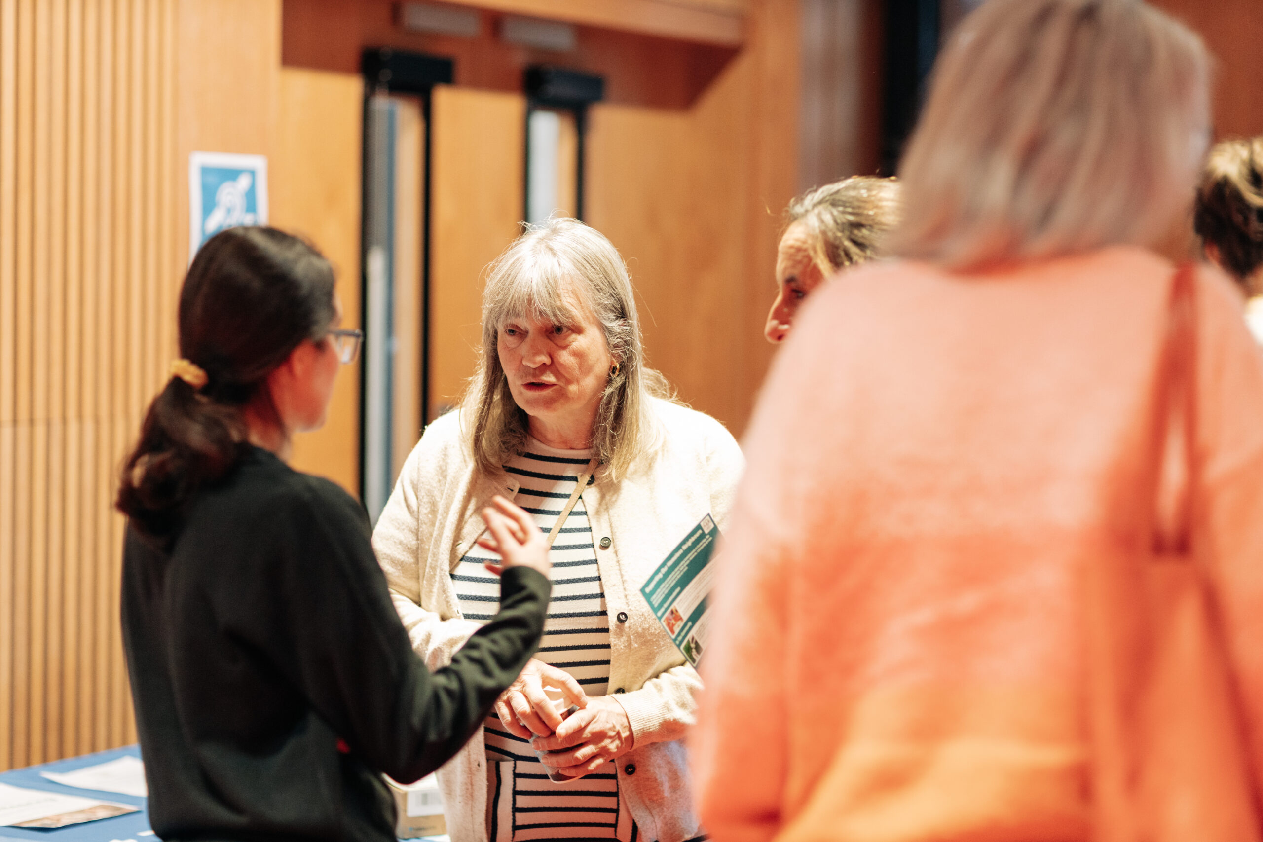 Lis speaking to attendees at Embrace event
